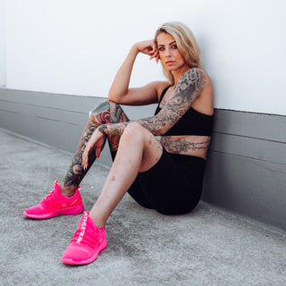 blond model with pink sneakers womens