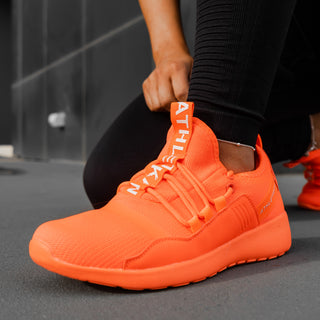 intense visual of orange sneakers women