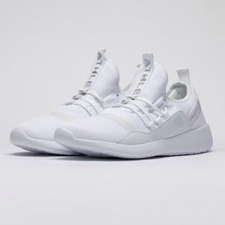 angled photo of high quality white trainers