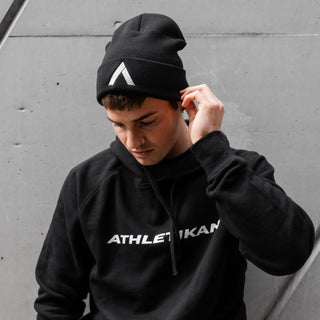 mens black beanie with model looking downwards