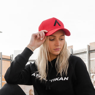 red cap womens shown by young blond model