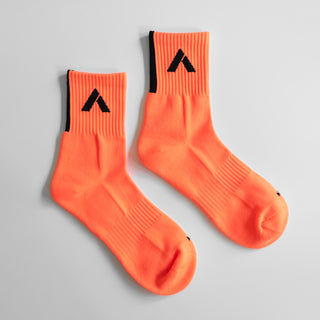 long orange socks detailed photo on a white background