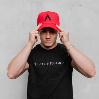 guy shows off red cap mens